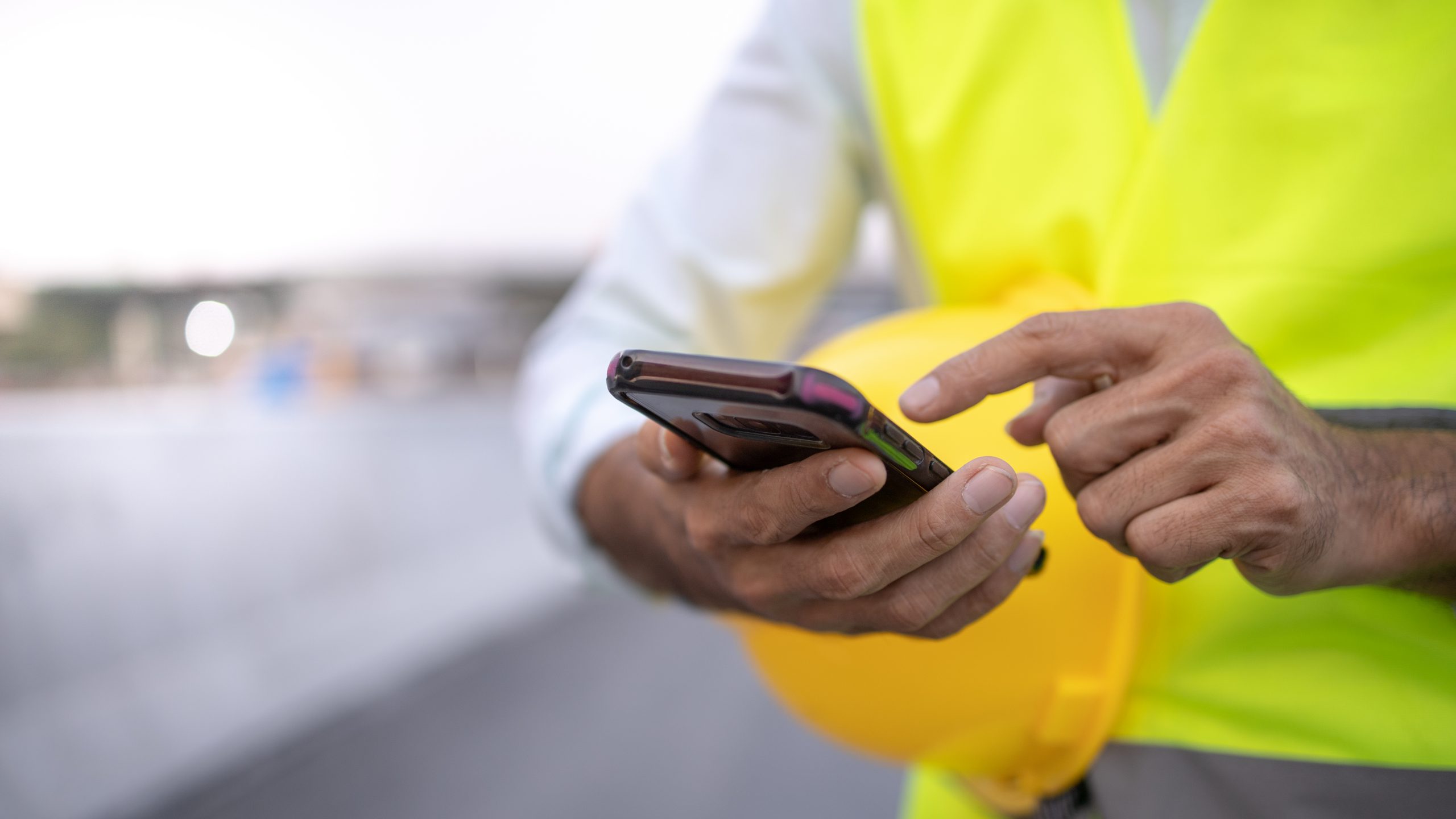 Engineer Working On His Smartphone At The Construction Site - CIRYS - Gemstone Logistics